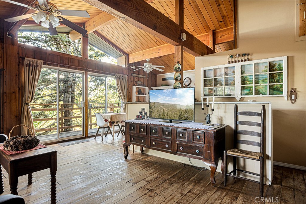 2151 Tank Road Running Springs, CA 92382 - Photo 3 of 29 a room with wooden furniture and a table