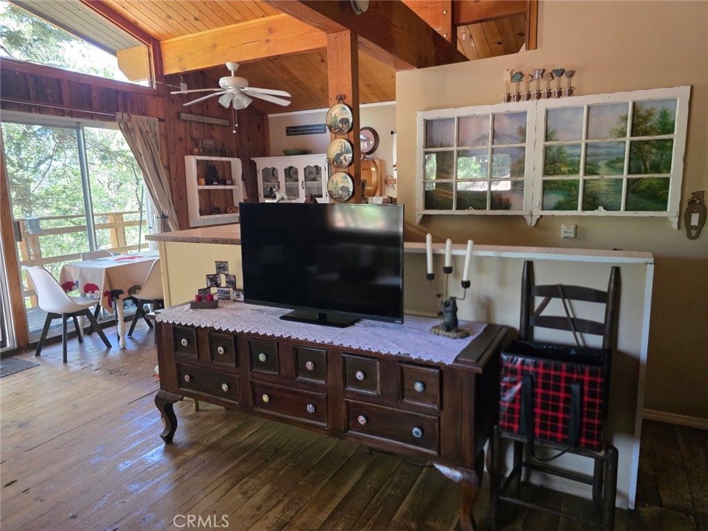 2151 Tank Road Running Springs, CA 92382 - Photo 7 of 29 a living room with furniture and a floor to ceiling window