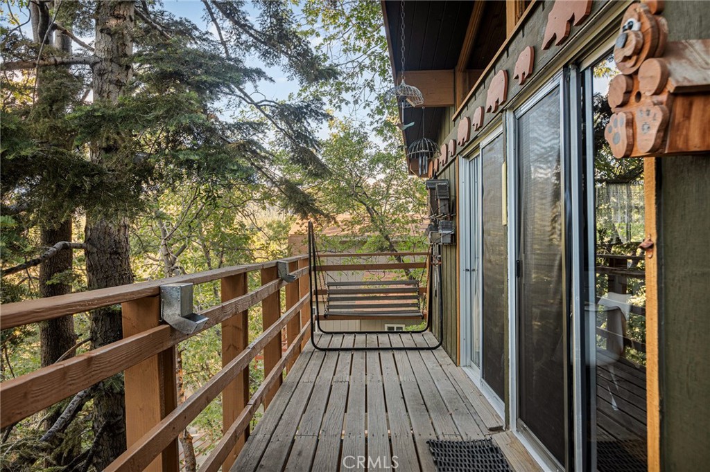 2151 Tank Road Running Springs, CA 92382 - Photo 8 of 29 a view of balcony with wooden floor and fence