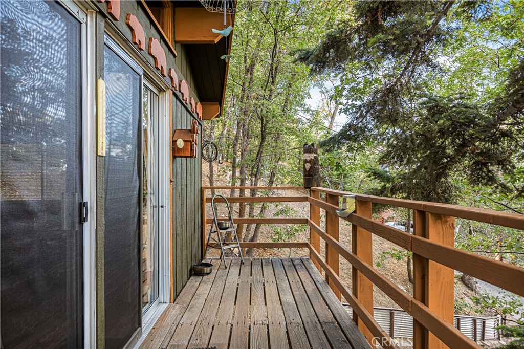 2151 Tank Road Running Springs, CA 92382 - Photo 9 of 29 a view of balcony with wooden floor and fence