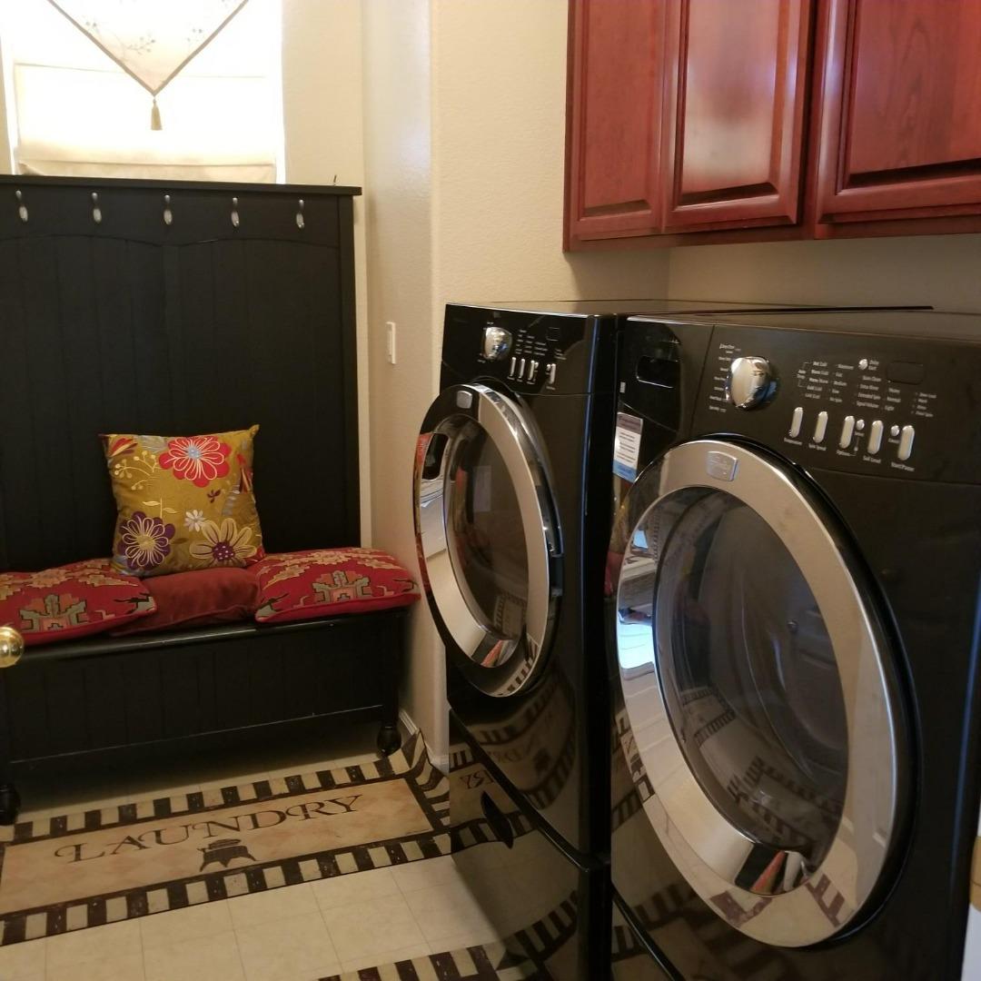 20640 Sarazen Place Patterson, CA 95363 - Photo 3 of 7 a room with a washing machine and a washer