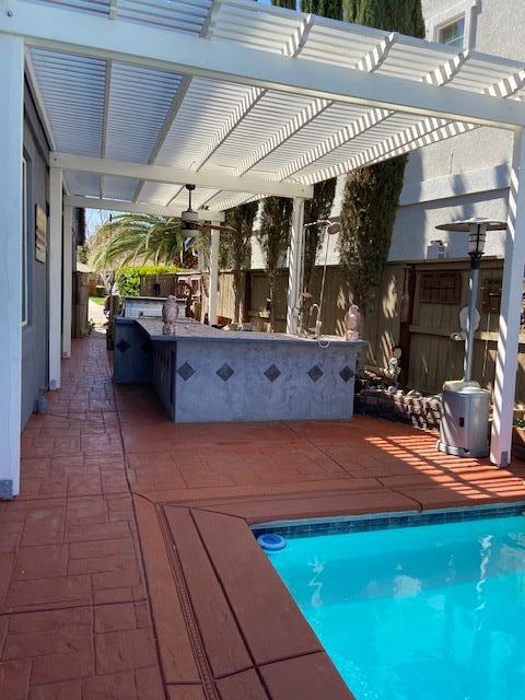 20640 Sarazen Place Patterson, CA 95363 - Photo 6 of 7 a view of swimming pool with outdoor seating