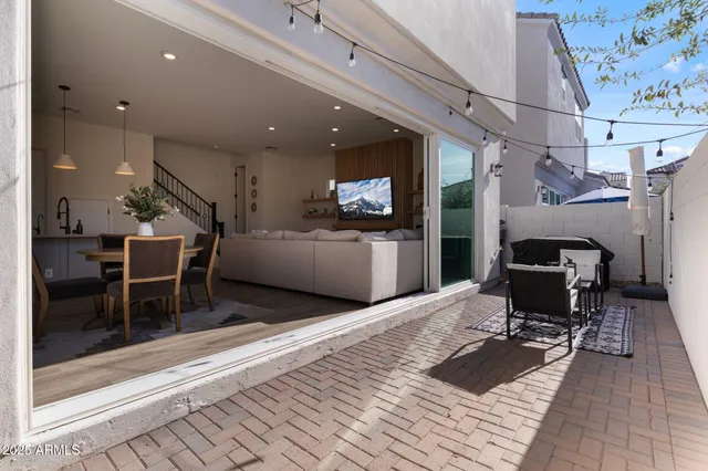 a living room with a couch and a fireplace