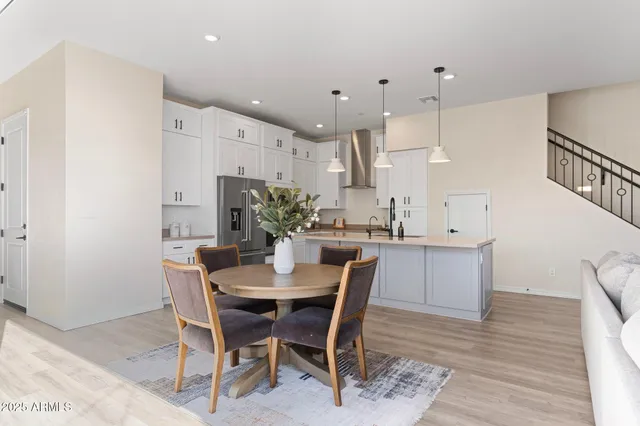 a dining room with furniture and window