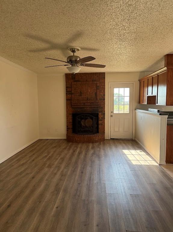 11204 Liberty School Road Pelican Bay, TX 76020 - Photo 11 of 23 an empty room with wooden floor fireplace and windows