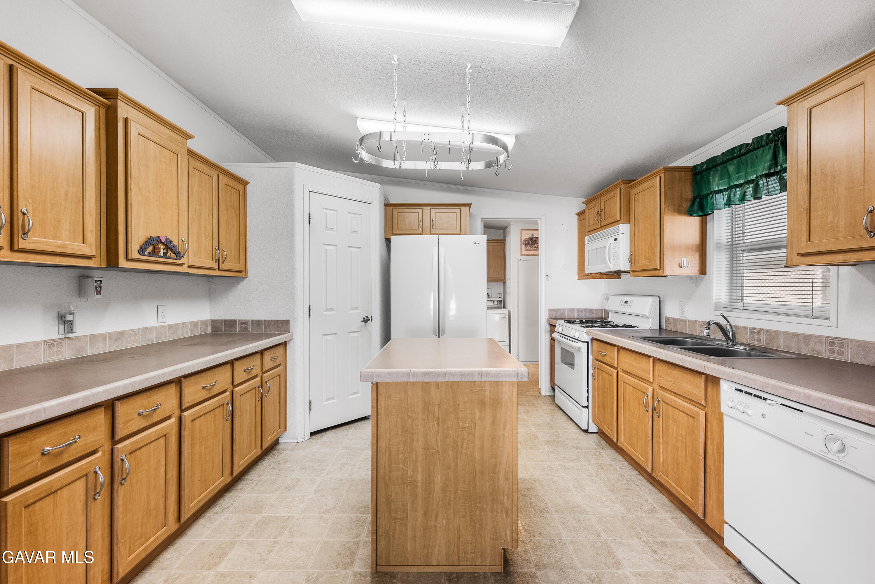 600 Dennison Road Tehachapi, CA 93561 - Photo 12 of 43 a large kitchen with stainless steel appliances granite countertop a sink and cabinets