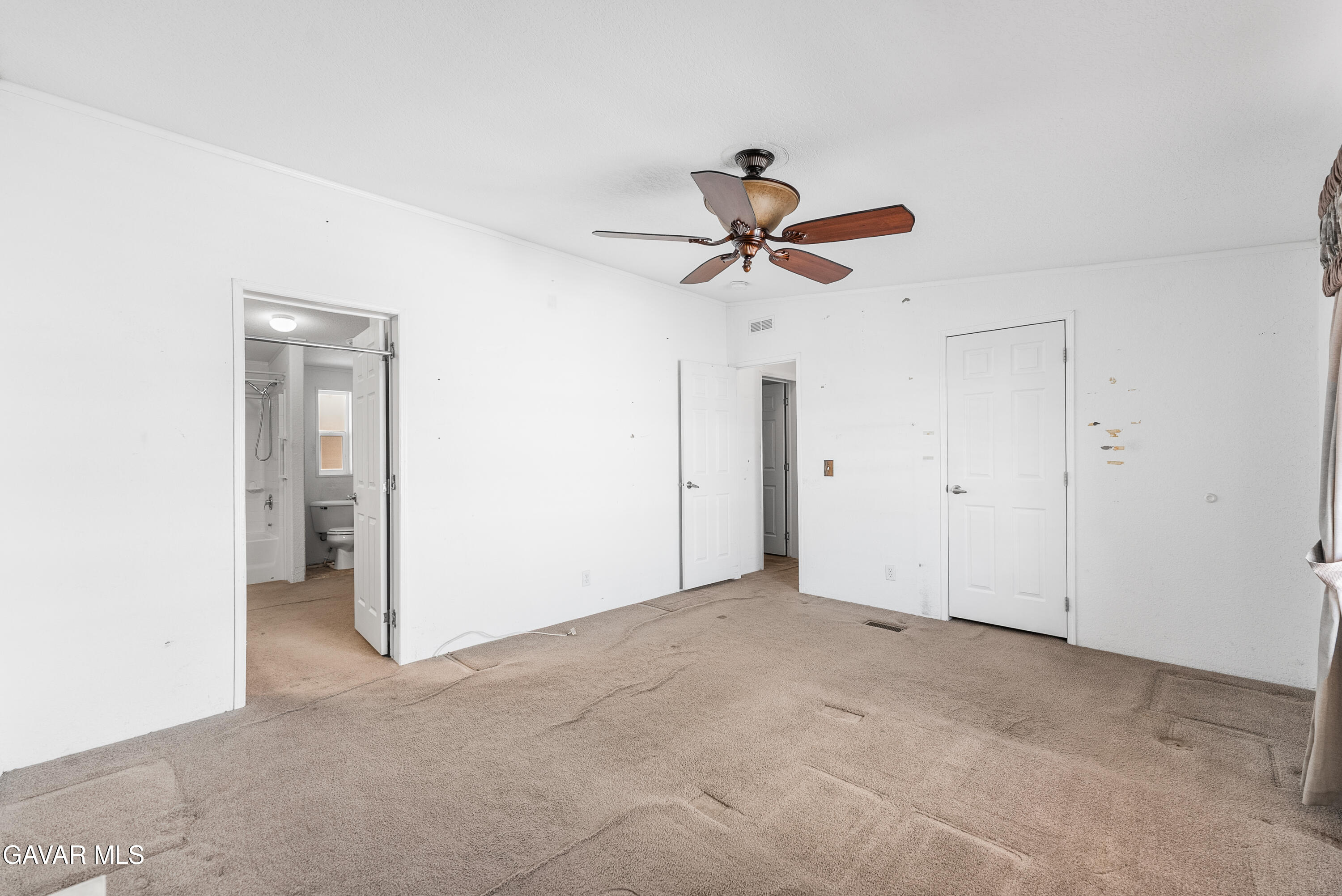 600 Dennison Road Tehachapi, CA 93561 - Photo 24 of 43 a view of a big room with a ceiling fan and a window