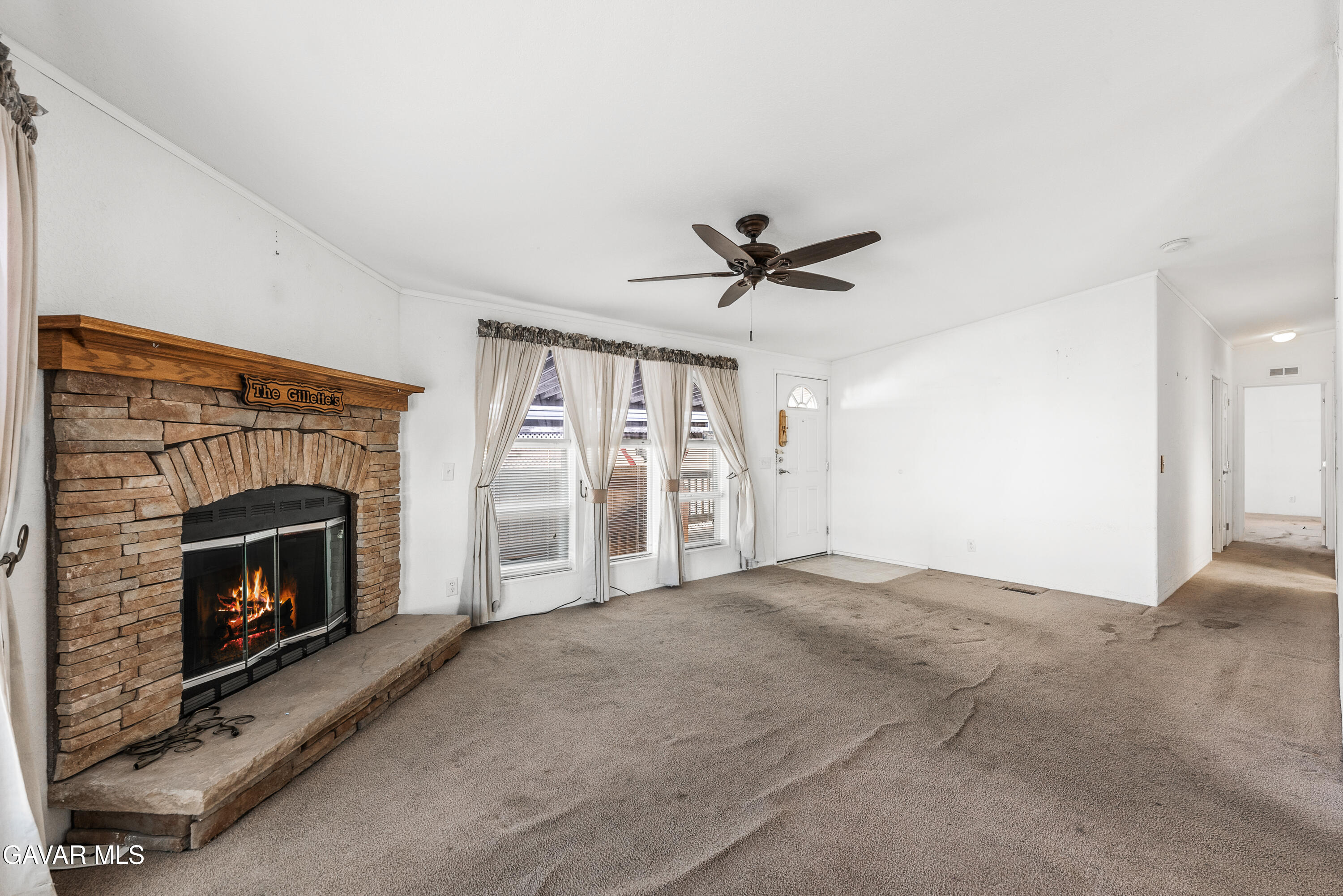 600 Dennison Road Tehachapi, CA 93561 - Photo 6 of 43 a view of empty room with fireplace and fan