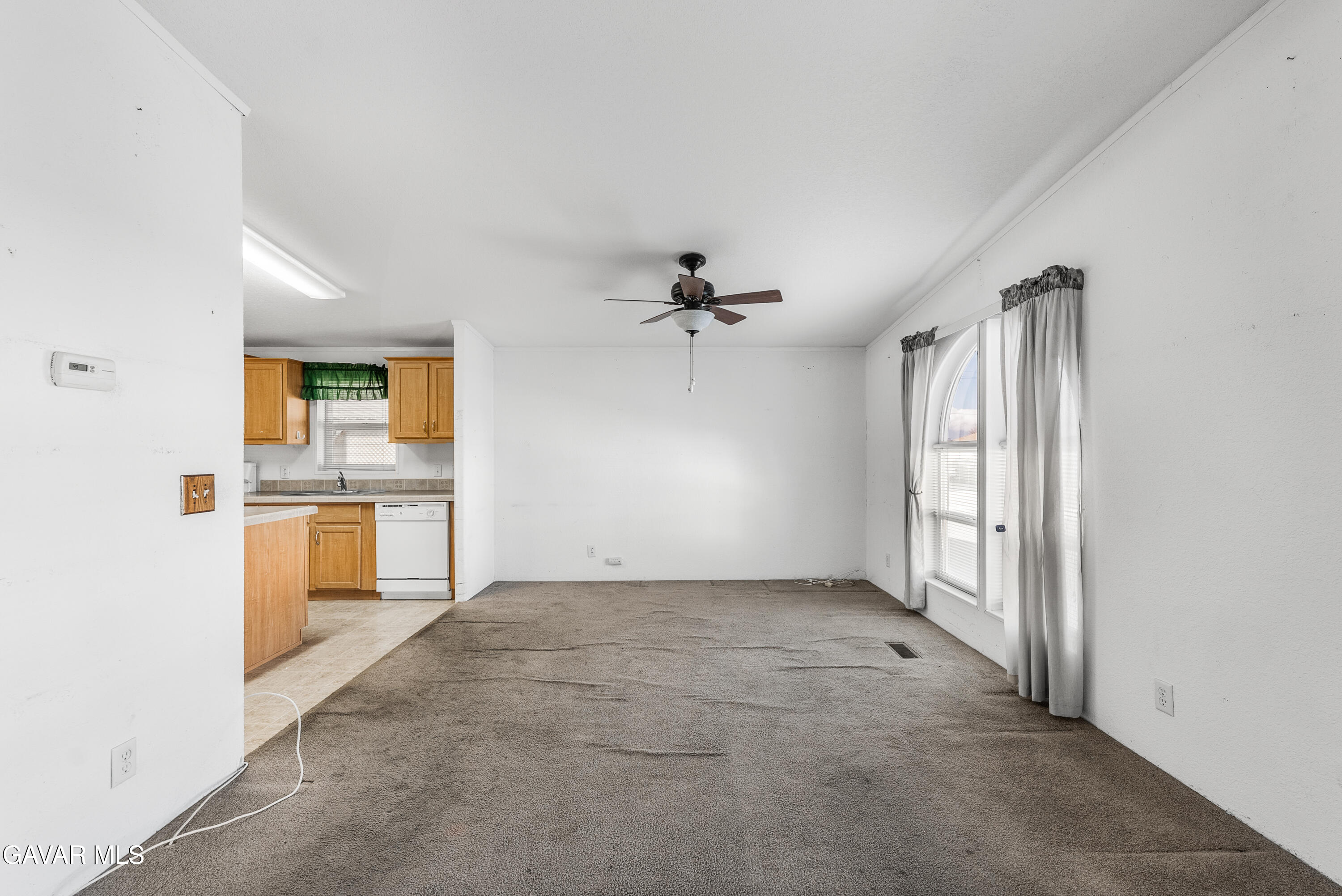 600 Dennison Road Tehachapi, CA 93561 - Photo 8 of 43 an empty room with a kitchen and a sink