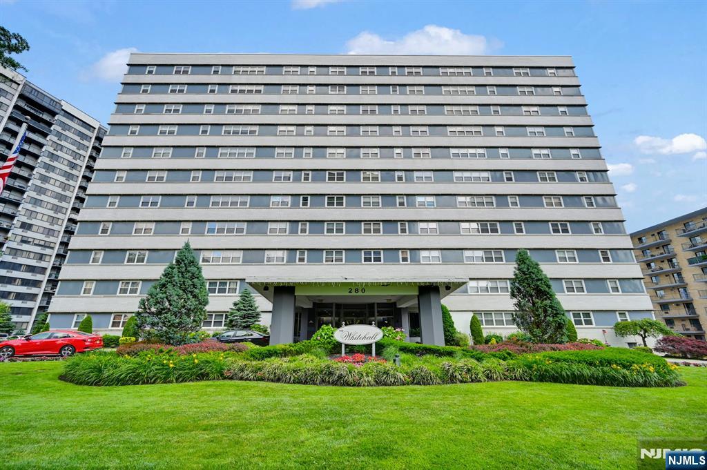 280 Prospect Avenue, Unit 3N Hackensack, NJ 07601 - Photo 3 of 23 a front view of a building with a garden