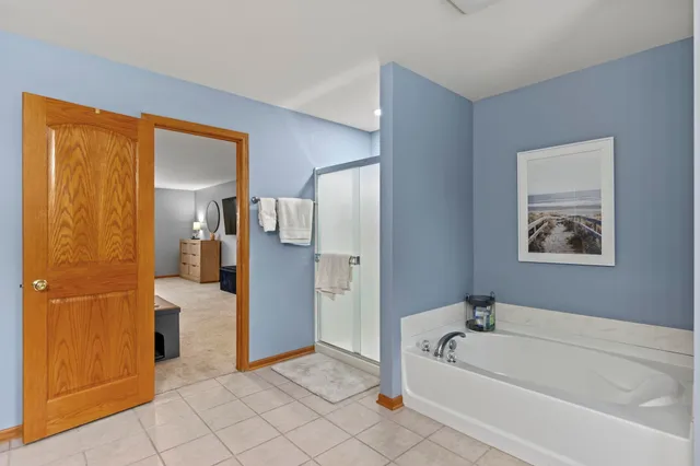 a view of walk in closet with clothes