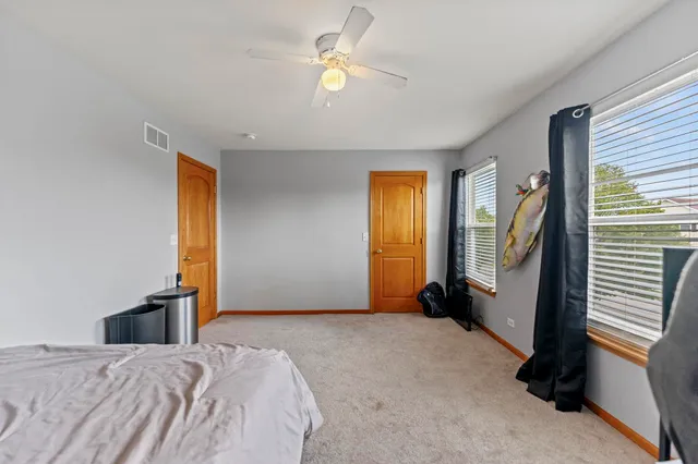 a living room with furniture and windows