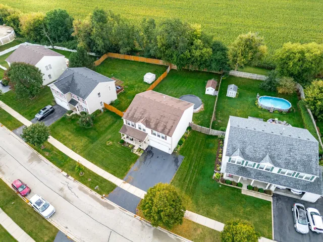 an aerial view of residential houses with outdoor space