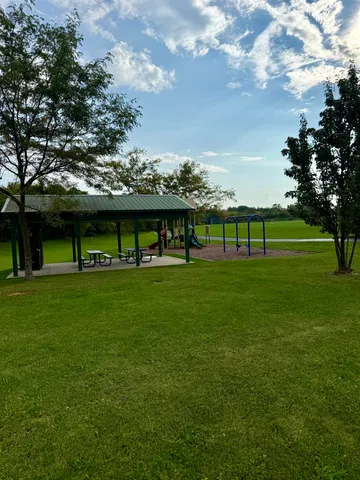 a view of a golf course with a lake