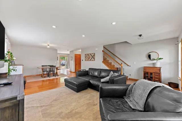 a living room with furniture potted plant and a window