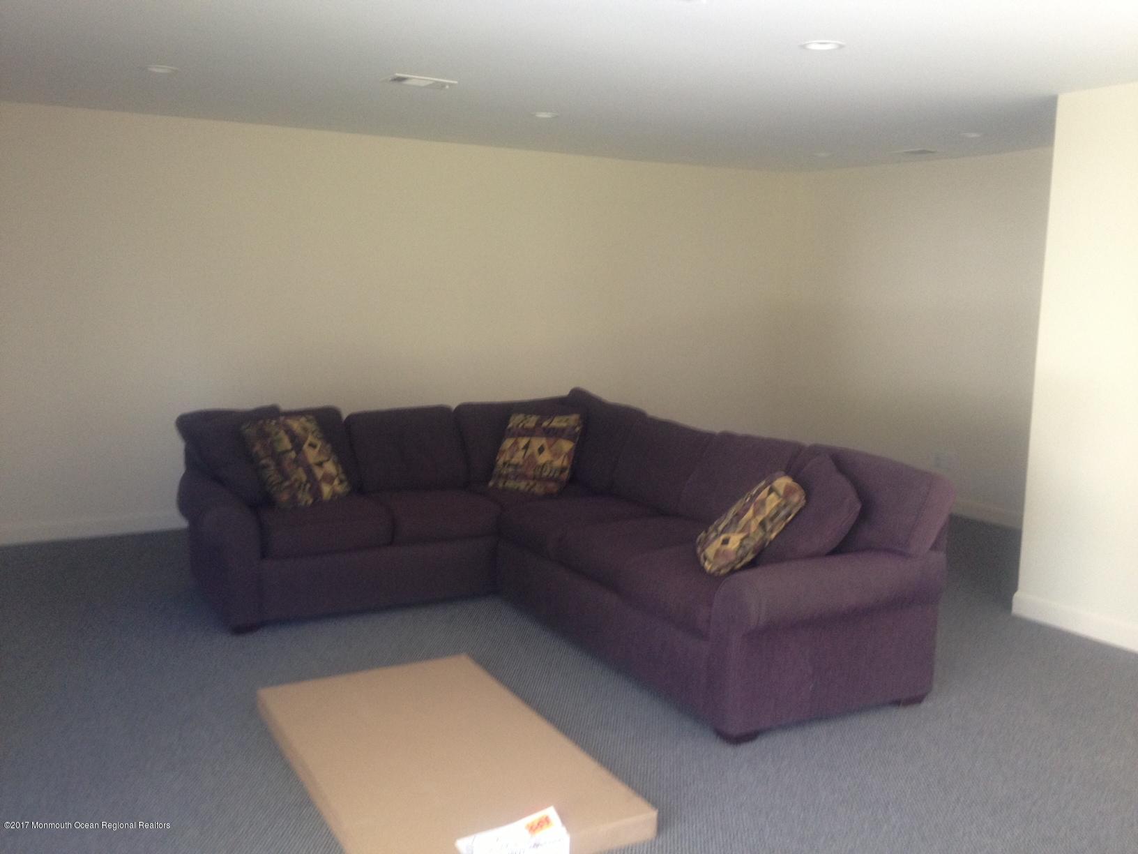 191 Norgrove Avenue Long Branch, NJ 07740 - Photo 5 of 6 a living room with a couch