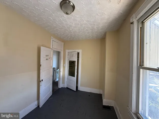 a view of a livingroom with wooden floor