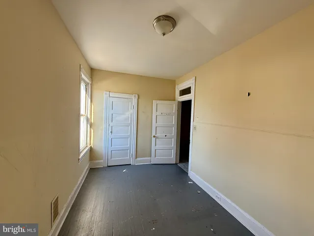 an empty room with windows