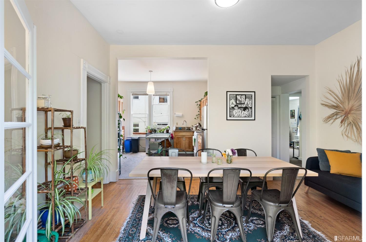 1934 Stuart Street Berkeley, CA 94703 - Photo 14 of 56 a view of a dining room with furniture a rug and wooden floor