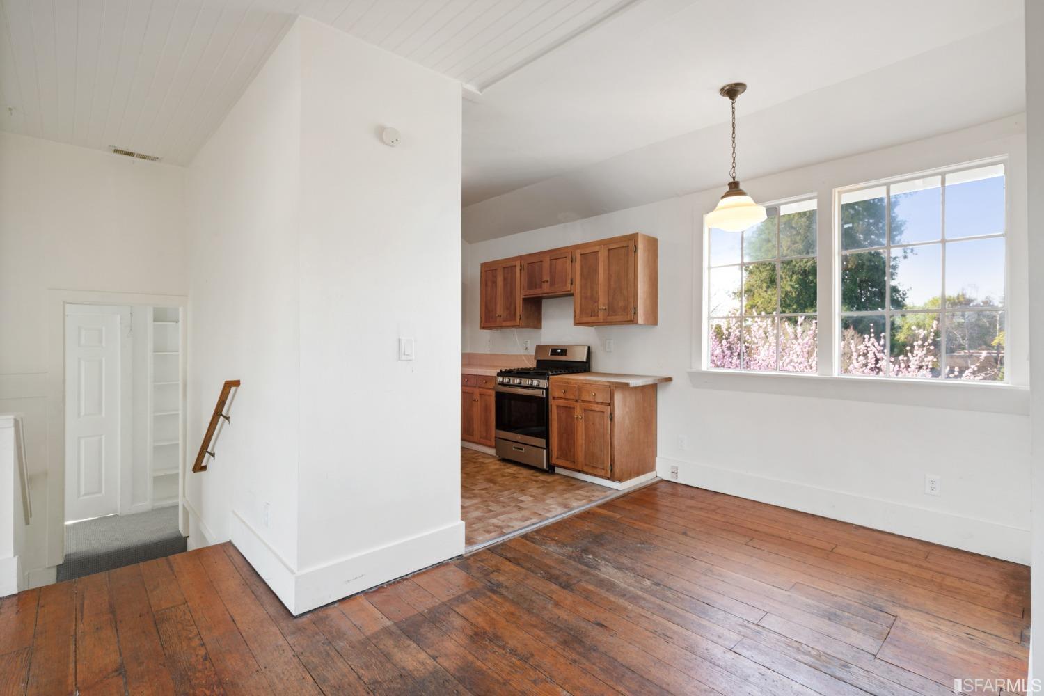 1934 Stuart Street Berkeley, CA 94703 - Photo 29 of 56 a kitchen with stainless steel appliances granite countertop a refrigerator a sink a stove a microwave and wooden floors