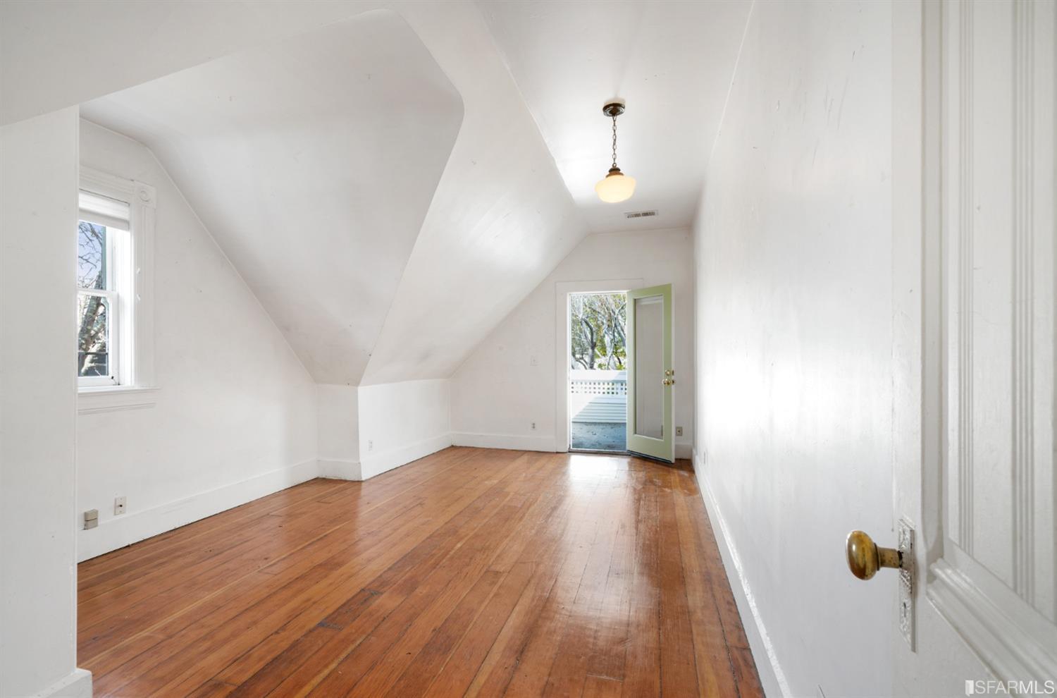 1934 Stuart Street Berkeley, CA 94703 - Photo 35 of 56 wooden floor in an empty room with a window