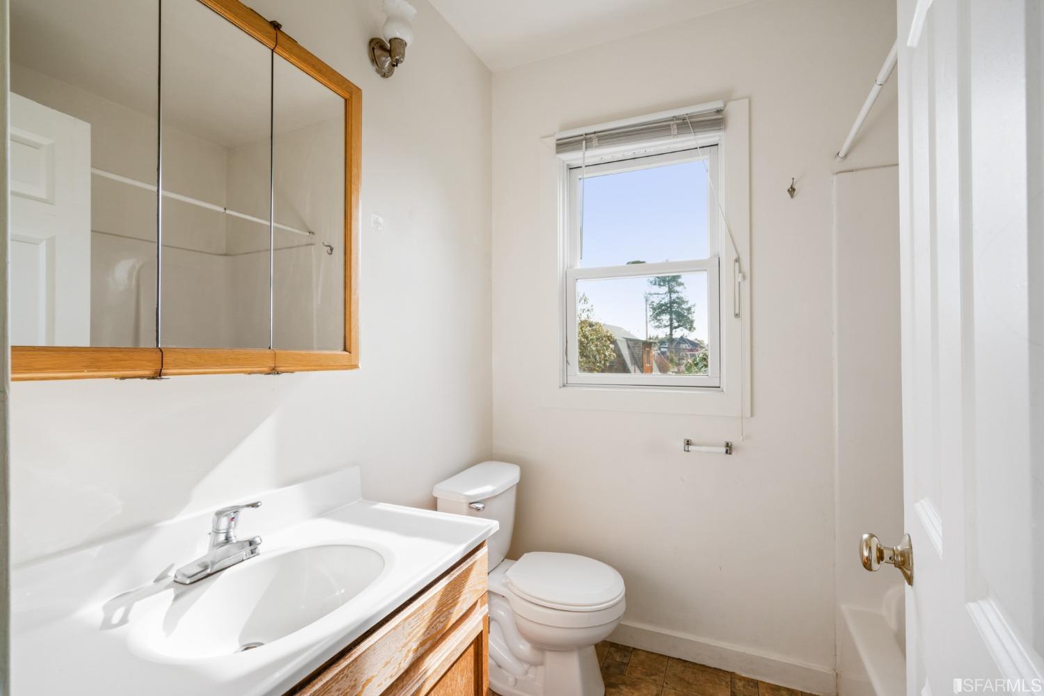 1934 Stuart Street Berkeley, CA 94703 - Photo 46 of 56 a bathroom with a sink toilet and mirror
