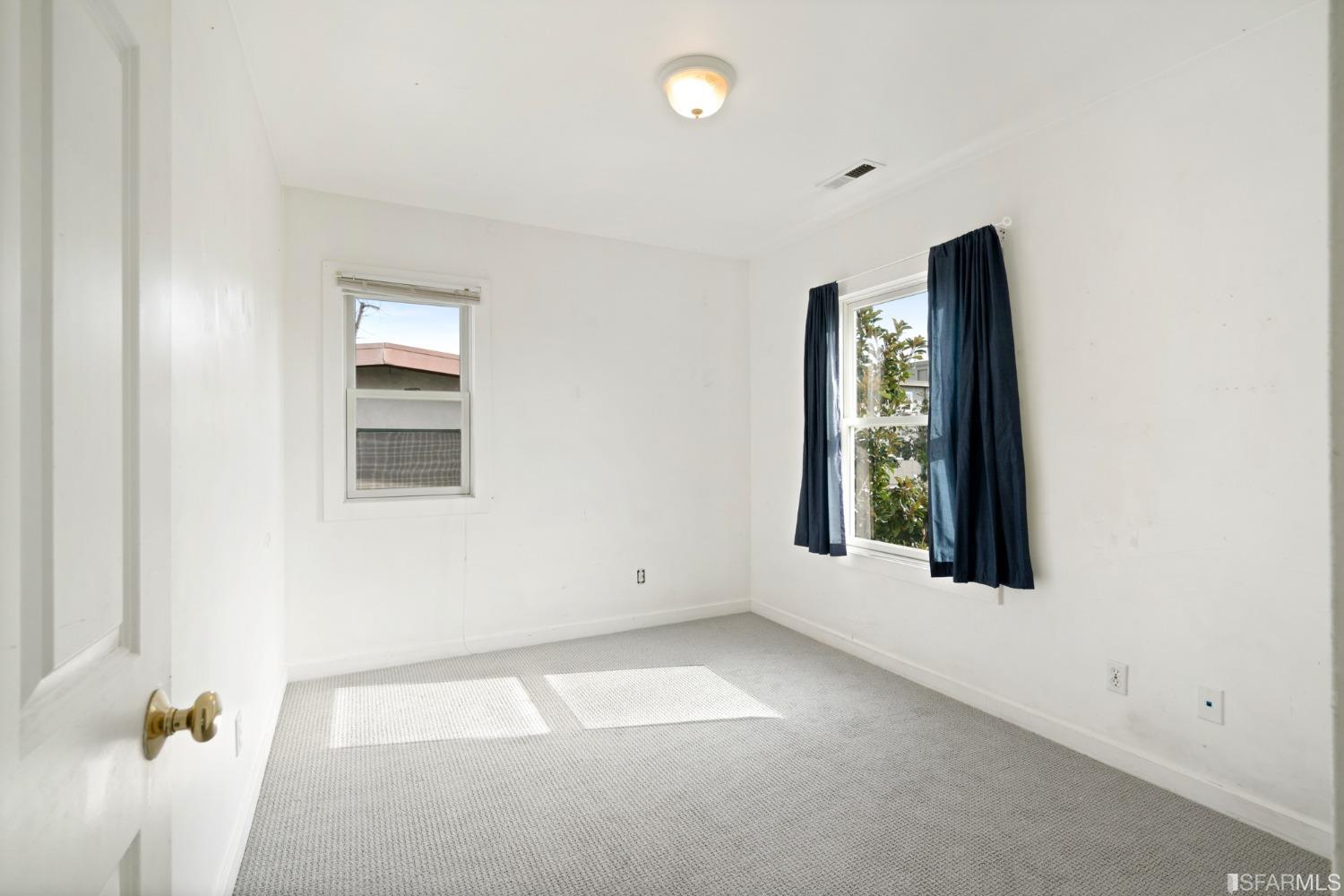 1934 Stuart Street Berkeley, CA 94703 - Photo 47 of 56 an empty room with windows and closet