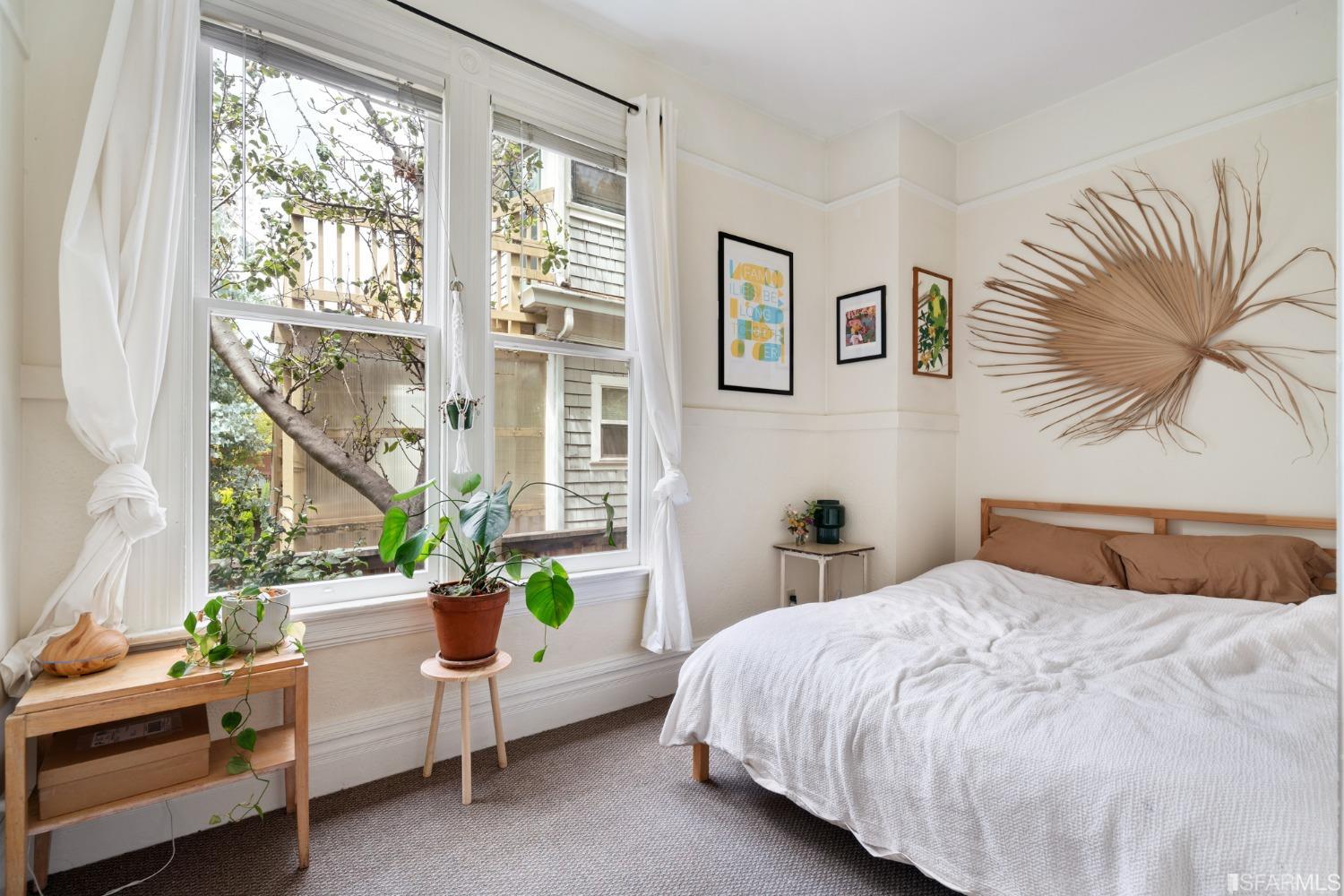 1934 Stuart Street Berkeley, CA 94703 - Photo 8 of 56 a bedroom with a bed and a window