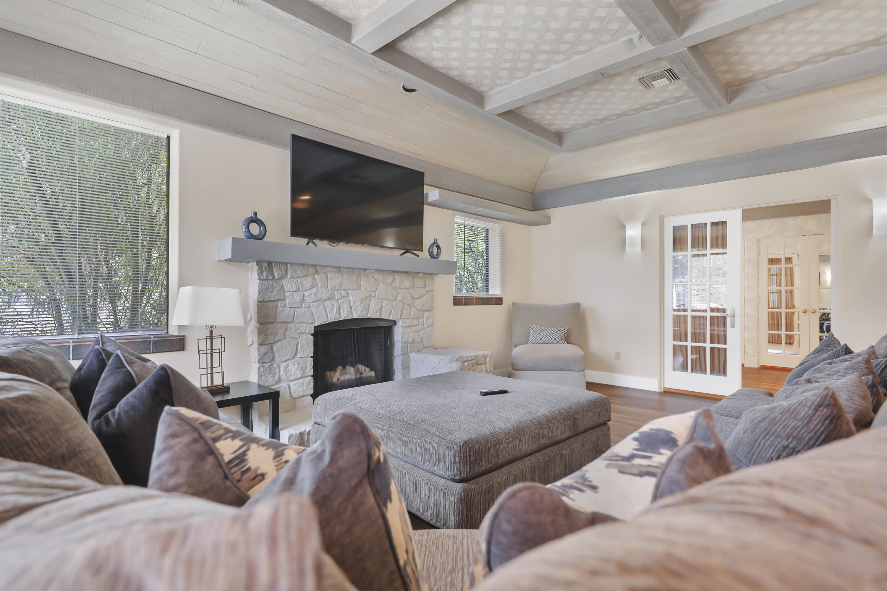 19120 Bubbling Wells Road Desert Hot Springs, CA 92241 - Photo 19 of 45 a living room with furniture fireplace and flat screen tv