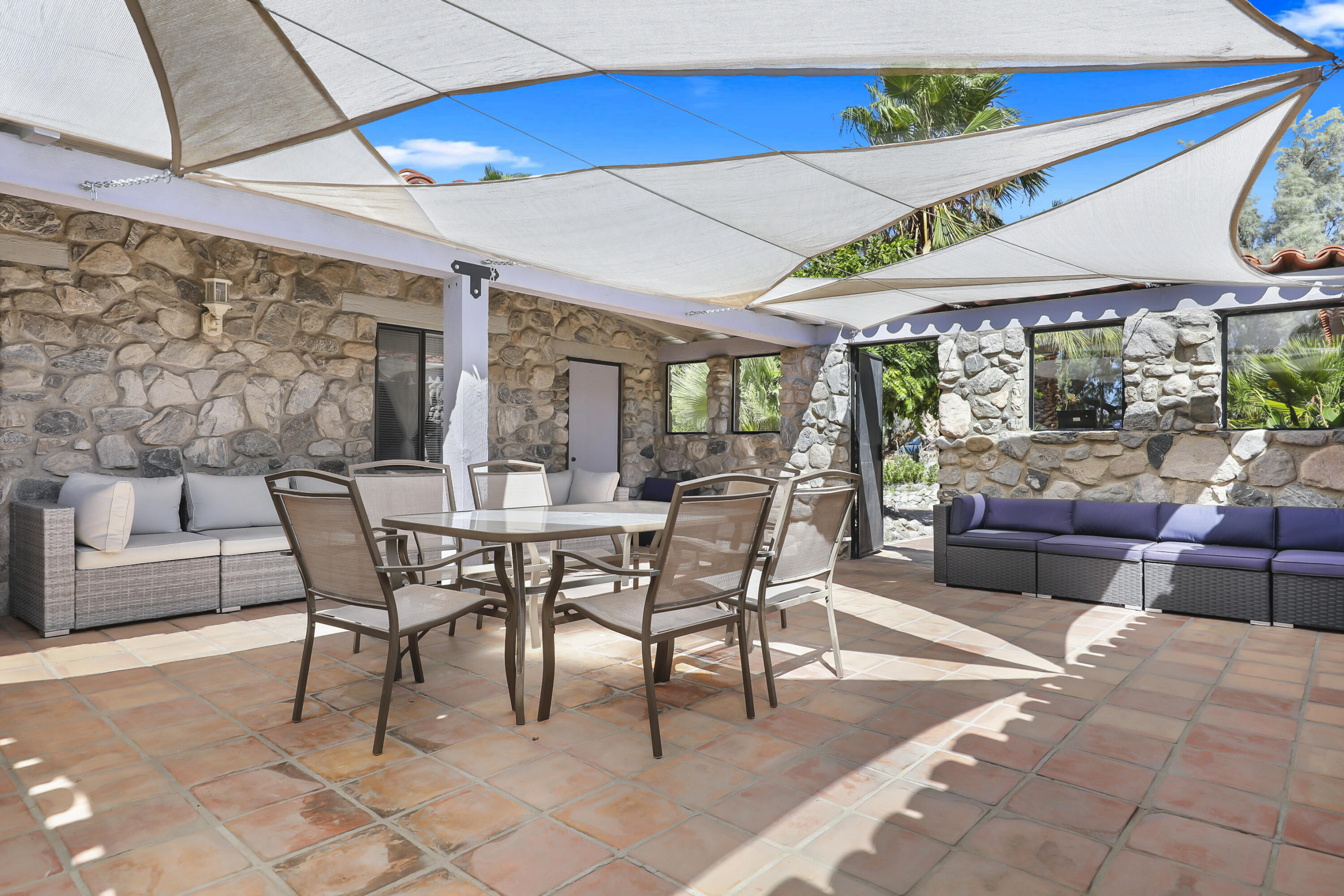 19120 Bubbling Wells Road Desert Hot Springs, CA 92241 - Photo 26 of 45 a dining room with furniture and wooden floor