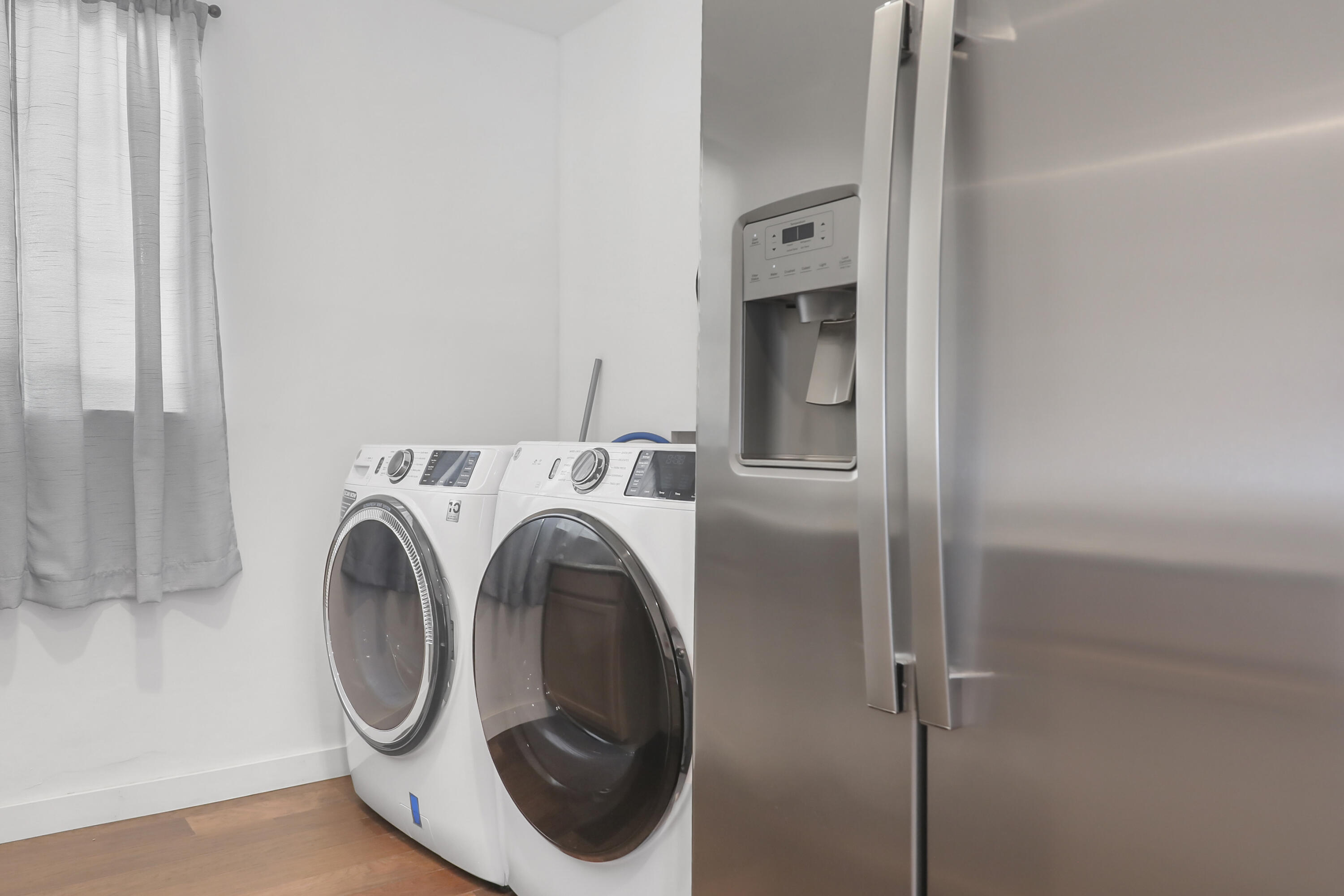 19120 Bubbling Wells Road Desert Hot Springs, CA 92241 - Photo 30 of 45 a utility room with dryer and washer