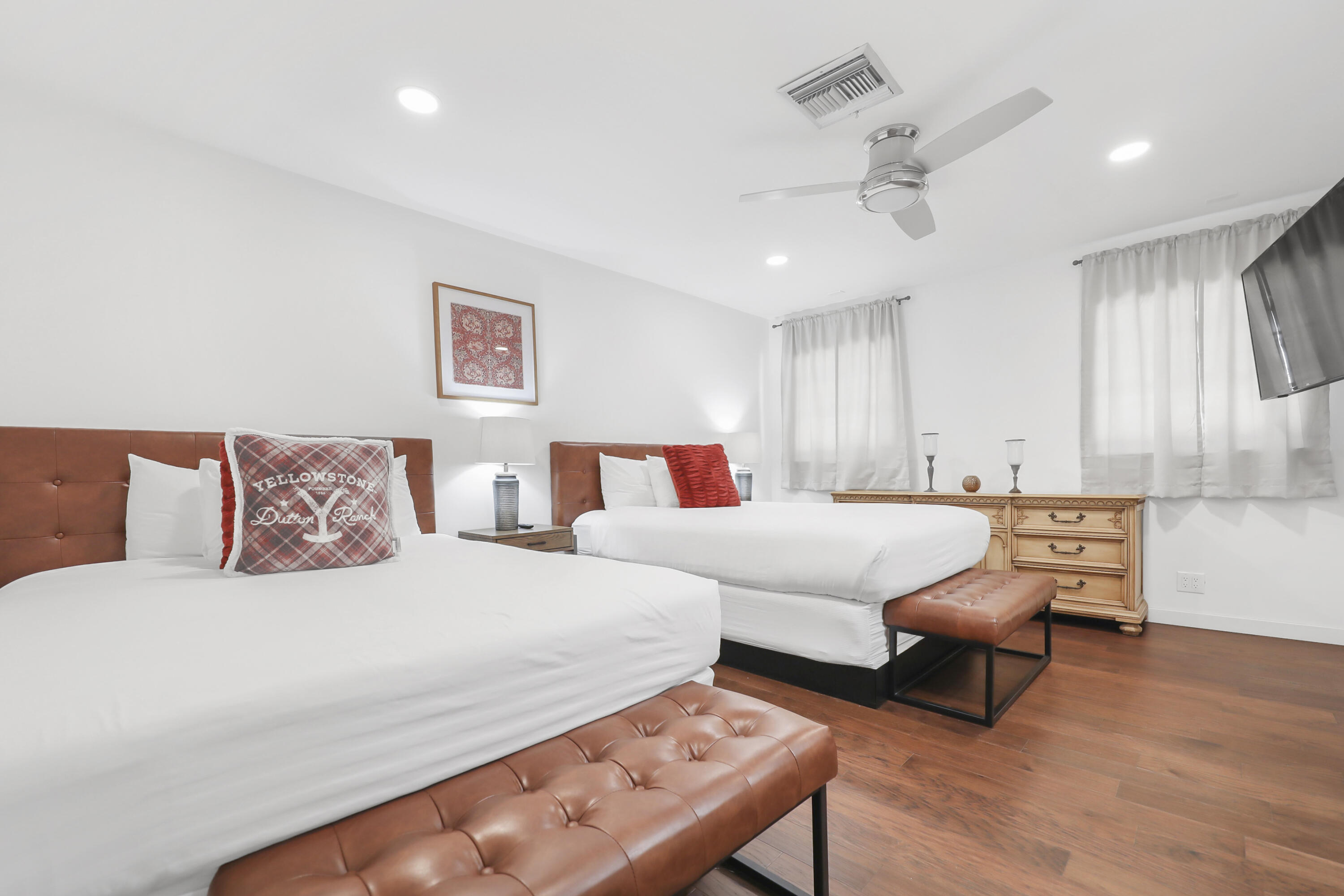 19120 Bubbling Wells Road Desert Hot Springs, CA 92241 - Photo 32 of 45 a bedroom with a bed and a chandelier