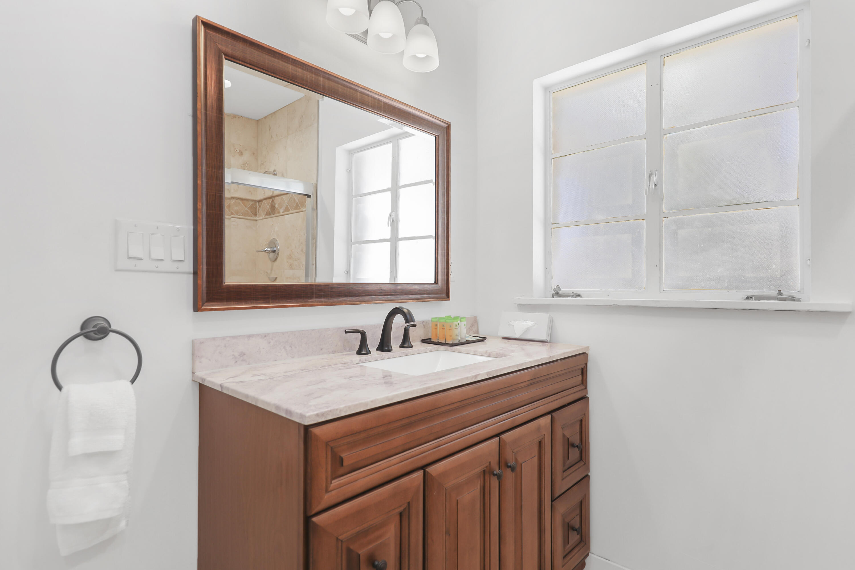 19120 Bubbling Wells Road Desert Hot Springs, CA 92241 - Photo 33 of 45 a bathroom with a sink and a mirror
