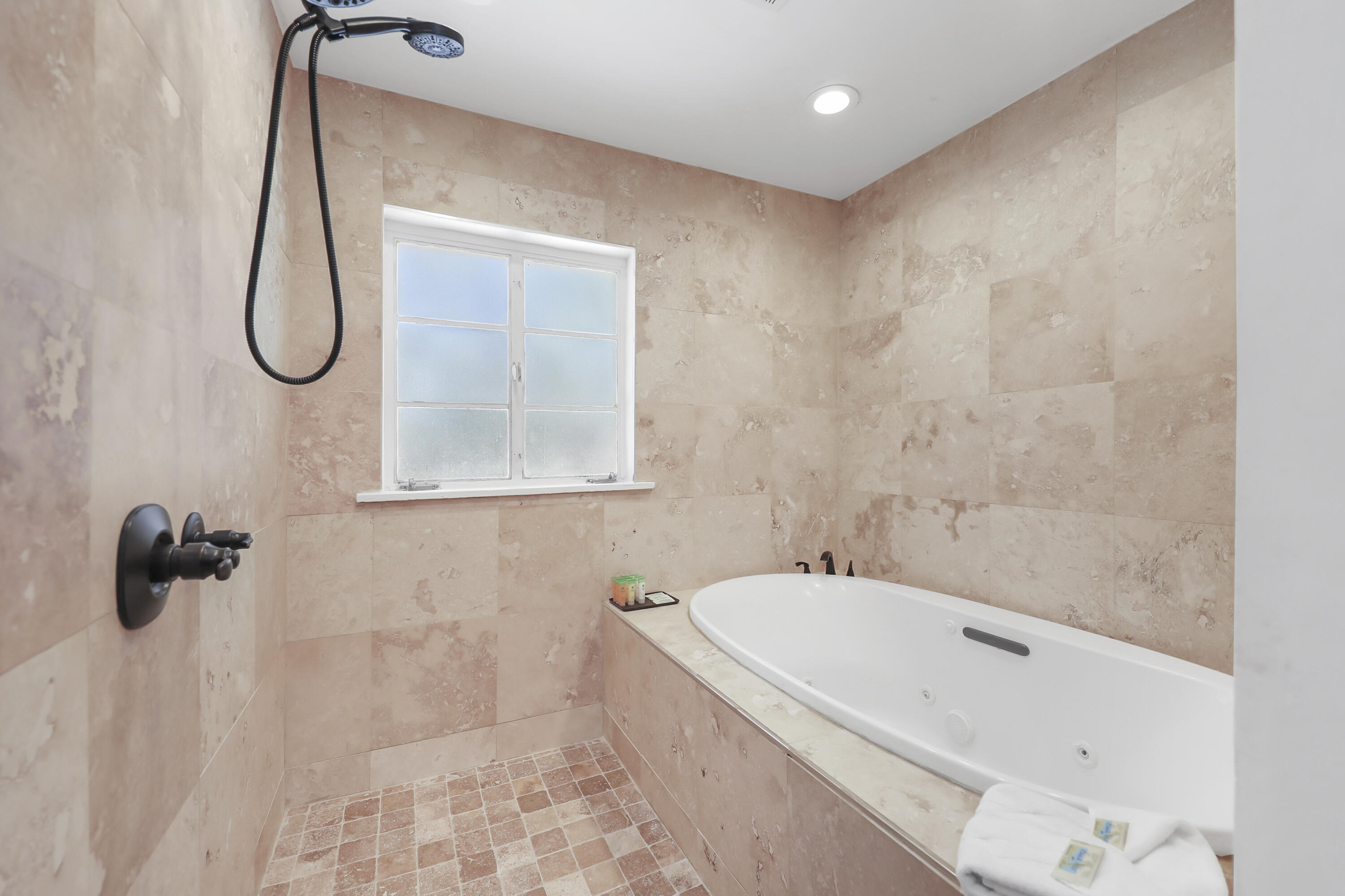 19120 Bubbling Wells Road Desert Hot Springs, CA 92241 - Photo 38 of 45 a bathroom with a bath tub with a shower