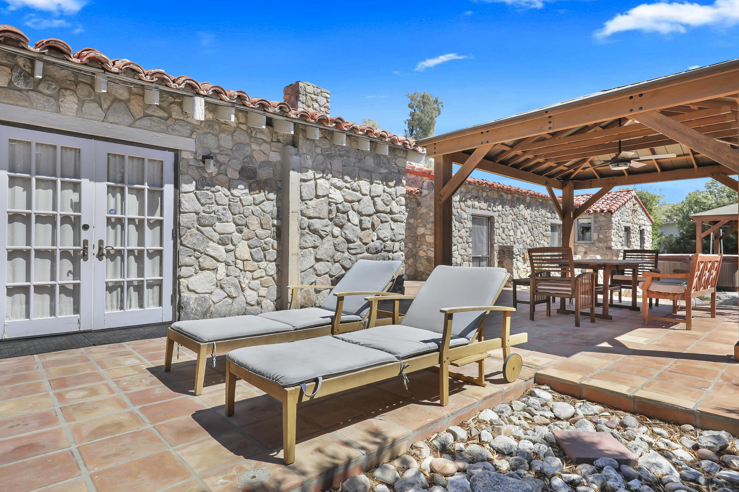 19120 Bubbling Wells Road Desert Hot Springs, CA 92241 - Photo 40 of 45 a roof deck with outdoor seating and city view