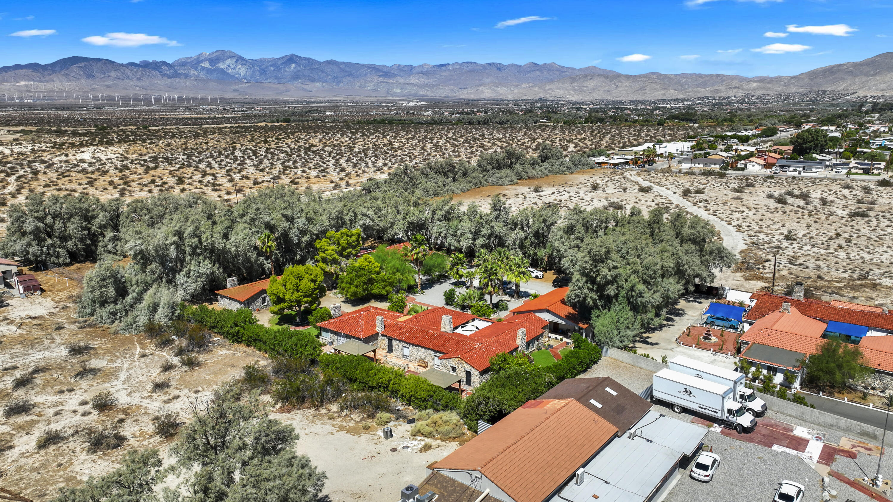 19120 Bubbling Wells Road Desert Hot Springs, CA 92241 - Photo 44 of 45 an aerial view of a city with lots of residential buildings ocean and mountain view in back
