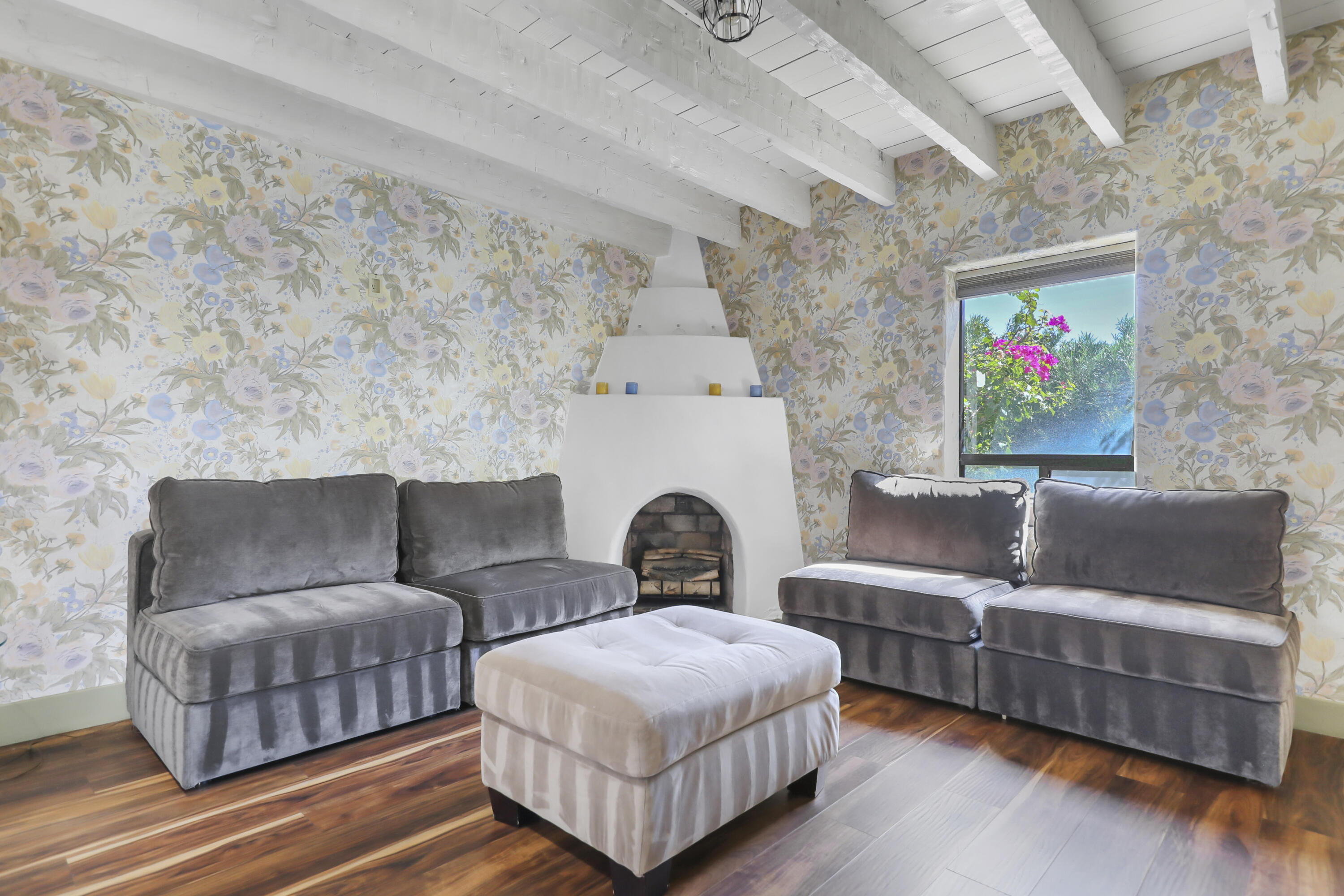 19120 Bubbling Wells Road Desert Hot Springs, CA 92241 - Photo 5 of 45 a living room with furniture and a fireplace