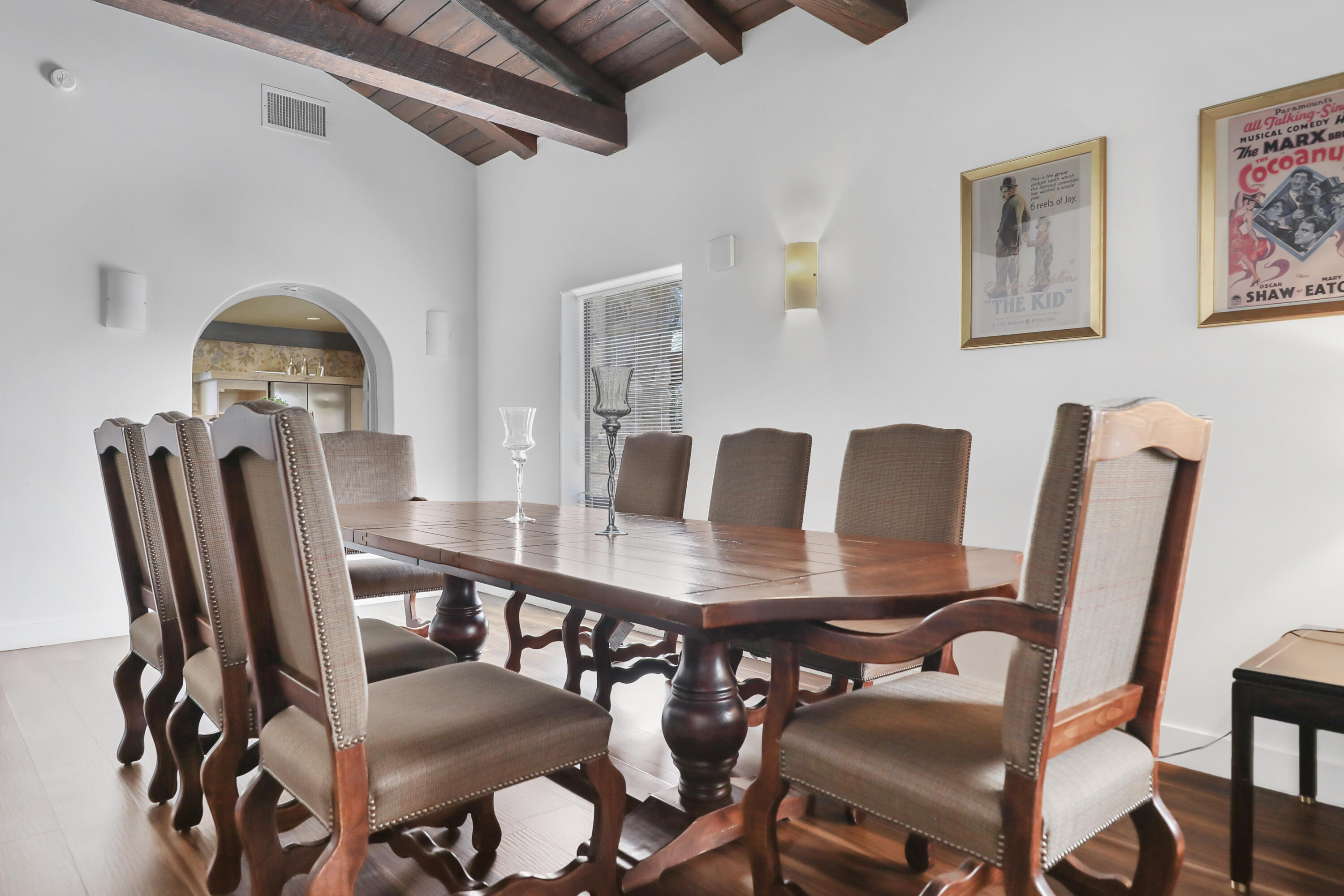 19120 Bubbling Wells Road Desert Hot Springs, CA 92241 - Photo 7 of 45 a view of a dining room with furniture and wooden floor