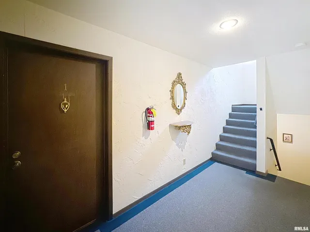 a bathroom with a sink mirror and toilet