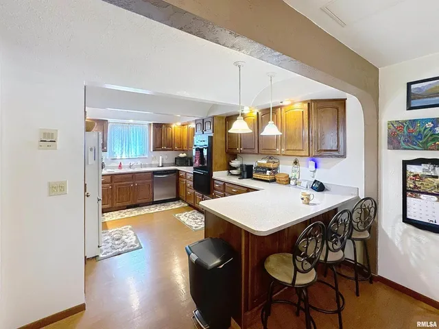 a front view of a house with a yard and a garage