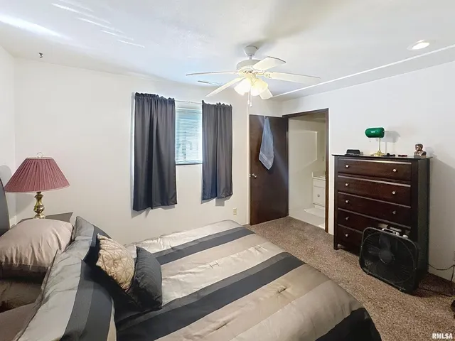 a view of a house with swimming pool and sitting area