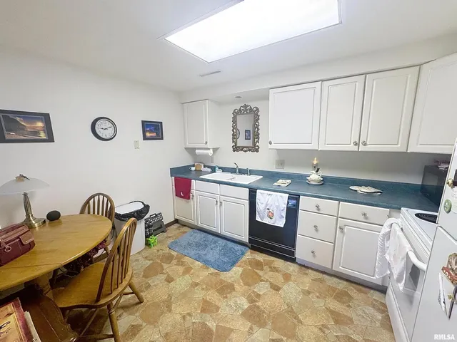 a view of entryway with wooden floor and windows