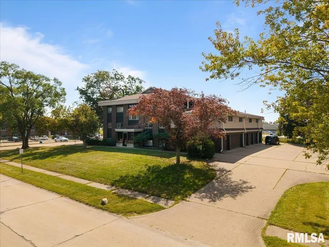 a kitchen with kitchen island granite countertop a stove and a sink