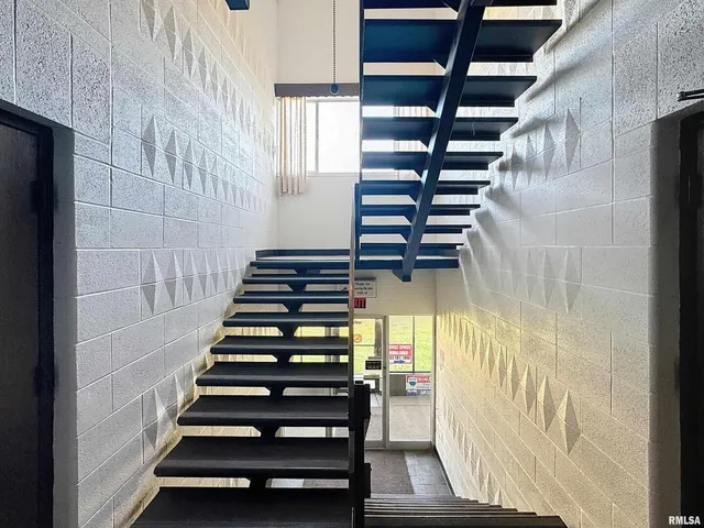 a view of balcony with wooden floor and outdoor seating