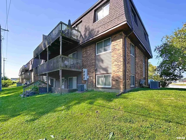 a brick building with a yard