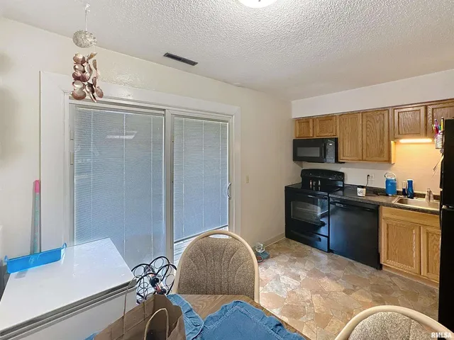 a bedroom with bed and a flat screen tv