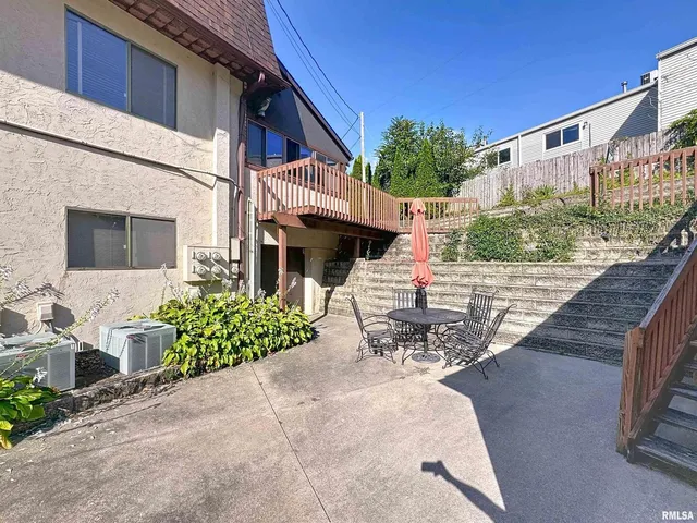a living room with furniture fireplace and a window