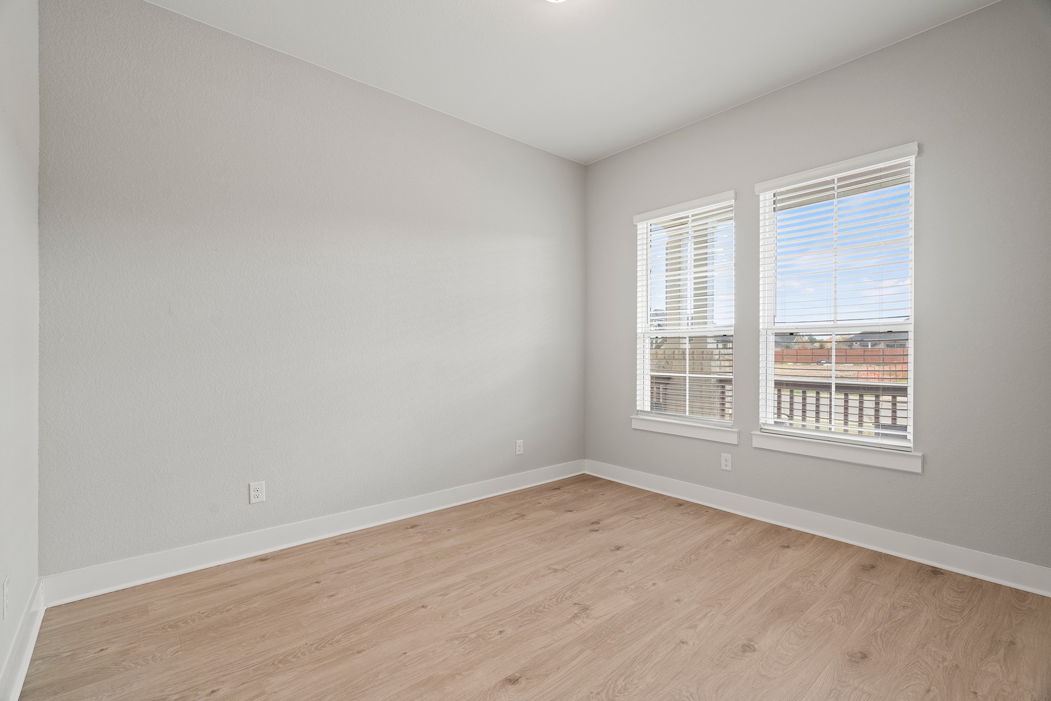 2112 Tobiano Trace Georgetown, TX 78633 - Photo 22 of 40 Empty room with light wood-style floors and baseboards