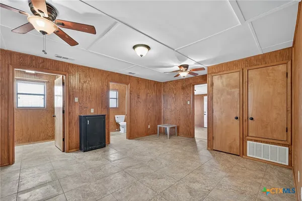 a view of an empty room with a window