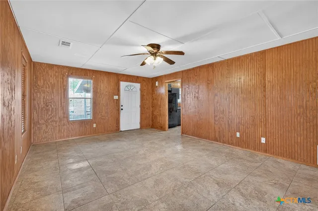 a view of an empty room with a window